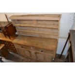 19th Century stripped pine dresser, the boarded shelf back above two drawers and two panelled doors,