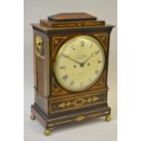 Regency rosewood and brass inlaid bracket clock, the circular enamel dial with Roman numerals