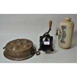 Spong & Company mincer, a copper mould and a Doulton stoneware foot warmer