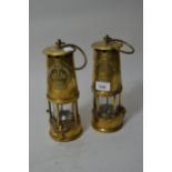 Two brass miner's safety lamps by The Protector Lamp and Lighting Company, Eccles