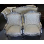 Reproduction French style three piece silvered and carved wooden salon suite upholstered in floral