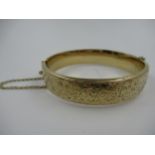 9ct Yellow gold floral engraved bangle, 18g