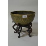 20th Century Chinese bronze bowl with relief decoration and seal mark to base, 9.75ins diameter,
