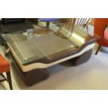 Modern designer two tone leather scroll form window seat / coffee table with tempered glass top,