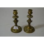 Pair of Regency brass candlesticks of anthemion and pineapple design, 6.25ins high