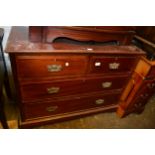 Edwardian mahogany chest of two short and two long drawers with brass handles and bracket feet,