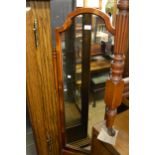 Reproduction yew wood cheval mirror on shaped supports