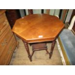 Late Victorian walnut octagonal two tier occasional table on turned supports