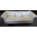 Reproduction Regency style silvered and moulded wooden sofa upholstered in floral damask, raised