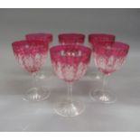Set of six clear and red drinking glasses with cut decoration