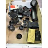 Praktica SLR camera together with various lenses and accessories