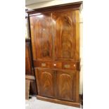 19th Century figured mahogany bookcase, the moulded cornice above a pair of arched figured panel