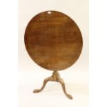 George III mahogany circular pedestal table with a turned wrythen column support and tripod base,