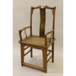 Chinese elm open elbow chair on rectangular moulded supports with stretchers