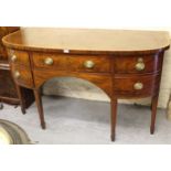 George III mahogany satinwood crossbanded bow front sideboard with four drawers and oval brass