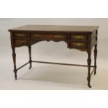 Howard & Sons, late 19th / early 20th Century rosewood writing table, the leather inset top above