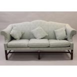 Reproduction mahogany hump back sofa in George III style on square cut moulded supports, 74ins