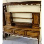 George III oak and mahogany crossbanded dresser, the shelf back with two cupboard doors above