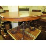 Victorian oval mahogany tilt top centre table on four turned and column splay supports, 52ins x