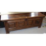 18th Century oak coffer, the hinged top above a four panel front raised on stile feet, 64ins x 18ins