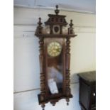 Late 19th Century walnut Vienna type wall clock, the painted dial with Roman numerals, subsidiary