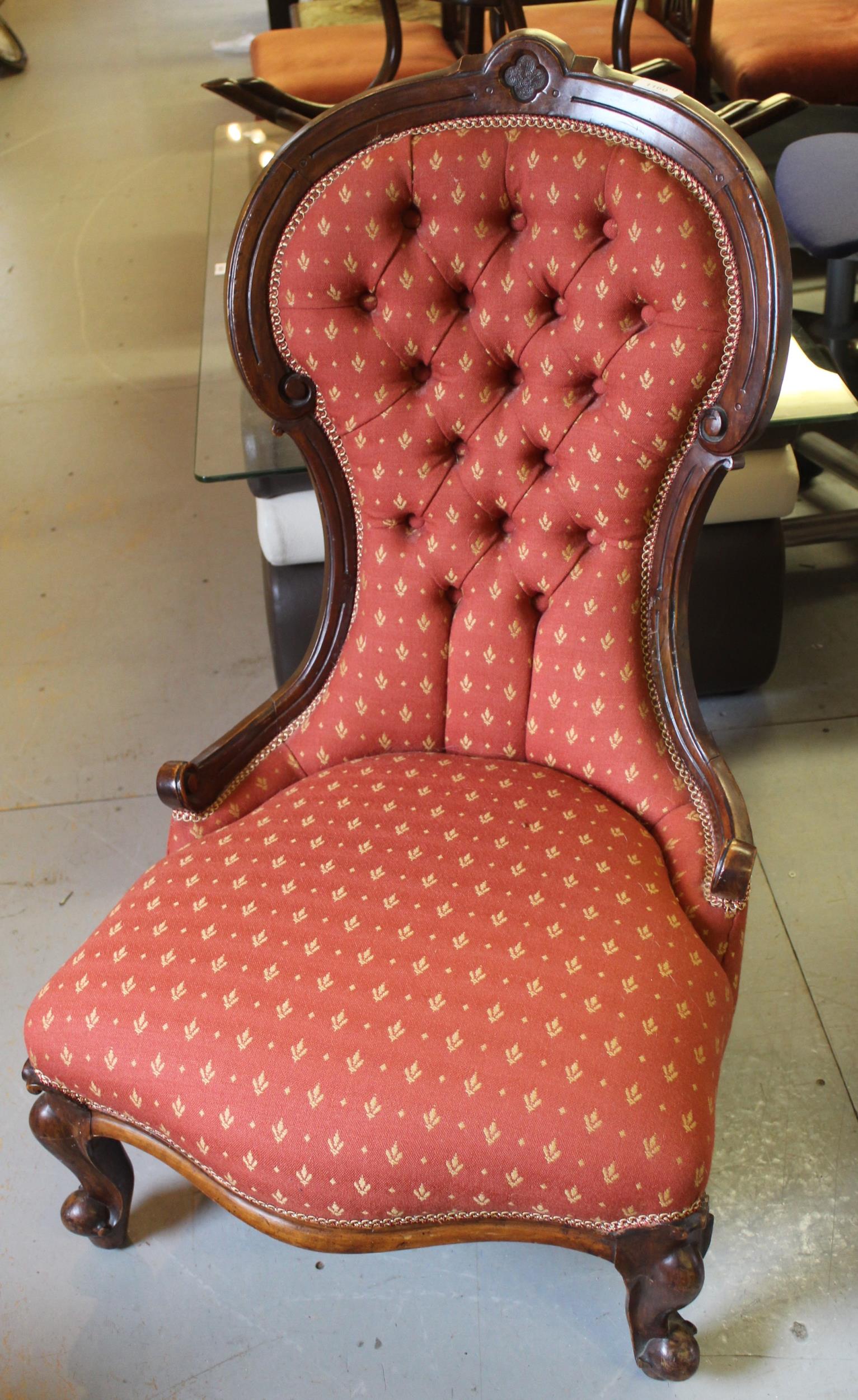 Victorian carved walnut button upholstered low seat nursing chair on cabriole front supports