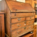 18th Century oak bureau, the fall front enclosing a fitted interior above two short and three long