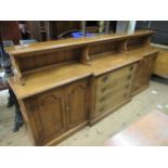 Good quality reproduction oak breakfront dwarf side cabinet with open shelves above centre