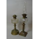 Early 20th Century brass and cut glass Corinthian column oil lamp and another similar (both at