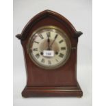 Early 20th Century mahogany arched top mantel clock, the silvered dial with Arabic and Roman