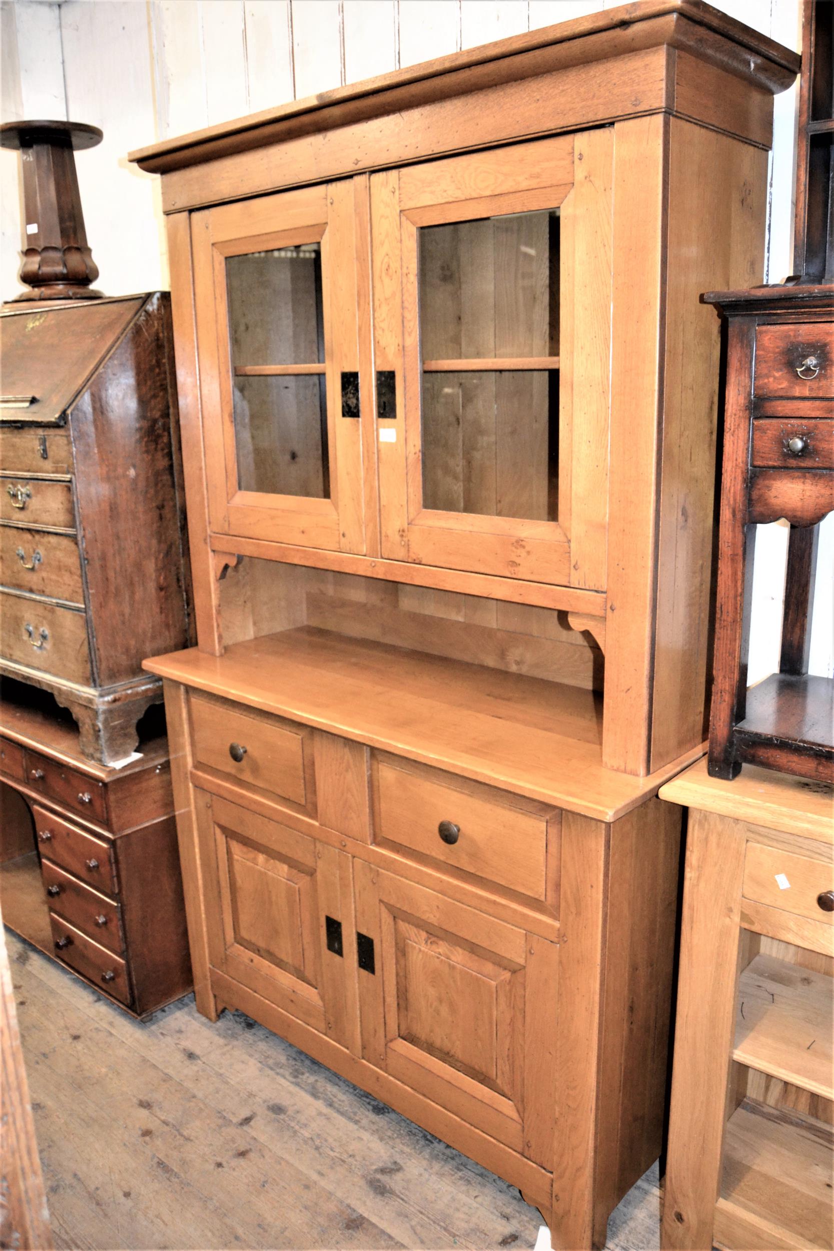 Good quality 20th Century light oak dresser, the moulded cornice above two glazed doors, two drawers