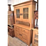 Good quality 20th Century light oak dresser, the moulded cornice above two glazed doors, two drawers