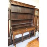George III oak dresser, the boarded shelf back above three drawers and rectangular supports with