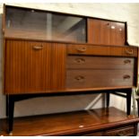 Mid 20th Century Nathan teak sideboard with an arrangement of drawers and cupboards on ebonised