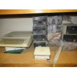 Apple IIe computer, together with eleven disc drives, a System 7 update and an owner's manual