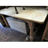 Reclaimed pine rectangular kitchen table raised on turned supports