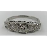 Platinum ring set with with five diamonds in box style, size N