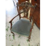 Edwardian carved mahogany open arm drawing room chair with a pierced floral and lattice work back on