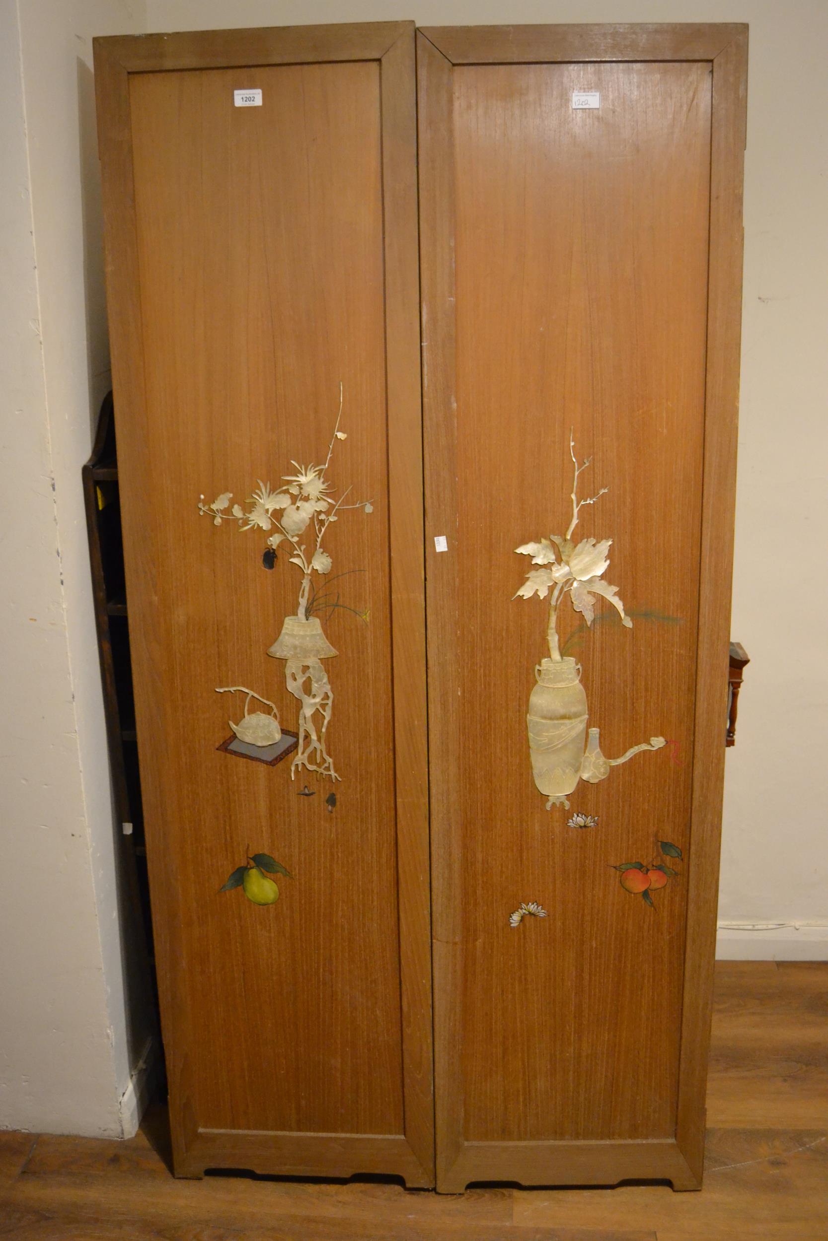 Pair of early 20th Century Japanese panels each mother of pearl inlaid with flowers etc., 18ins wide