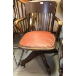 1930's Oak swivel office armchair with slat back, later covered seat by Angus of London