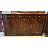 19th Century mahogany sideboard, the shallow figured top above four small frieze drawers and three