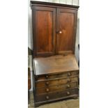 George III mahogany bureau bookcase, the moulded cornice above a pair of panelled doors and pair