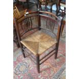 Arts and Crafts beechwood corner chair with rush seat together with a walnut rectangular