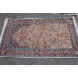 Small cotton prayer rug of Persian design with an all-over vase and floral pattern in shades of pink