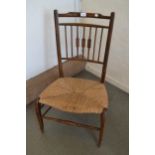 Early 20th Century beechwood nursing chair with a spindle back and newly rushed seat