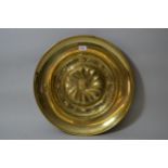 19th Century embossed brass alms dish, 19.75ins diameter