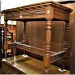Edwardian walnut fold-over card table with leather inset top above two frieze drawers, on turned