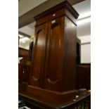 Small late Victorian walnut cabinet with two panel doors on a plinth base, 18ins x 10ins x 32ins