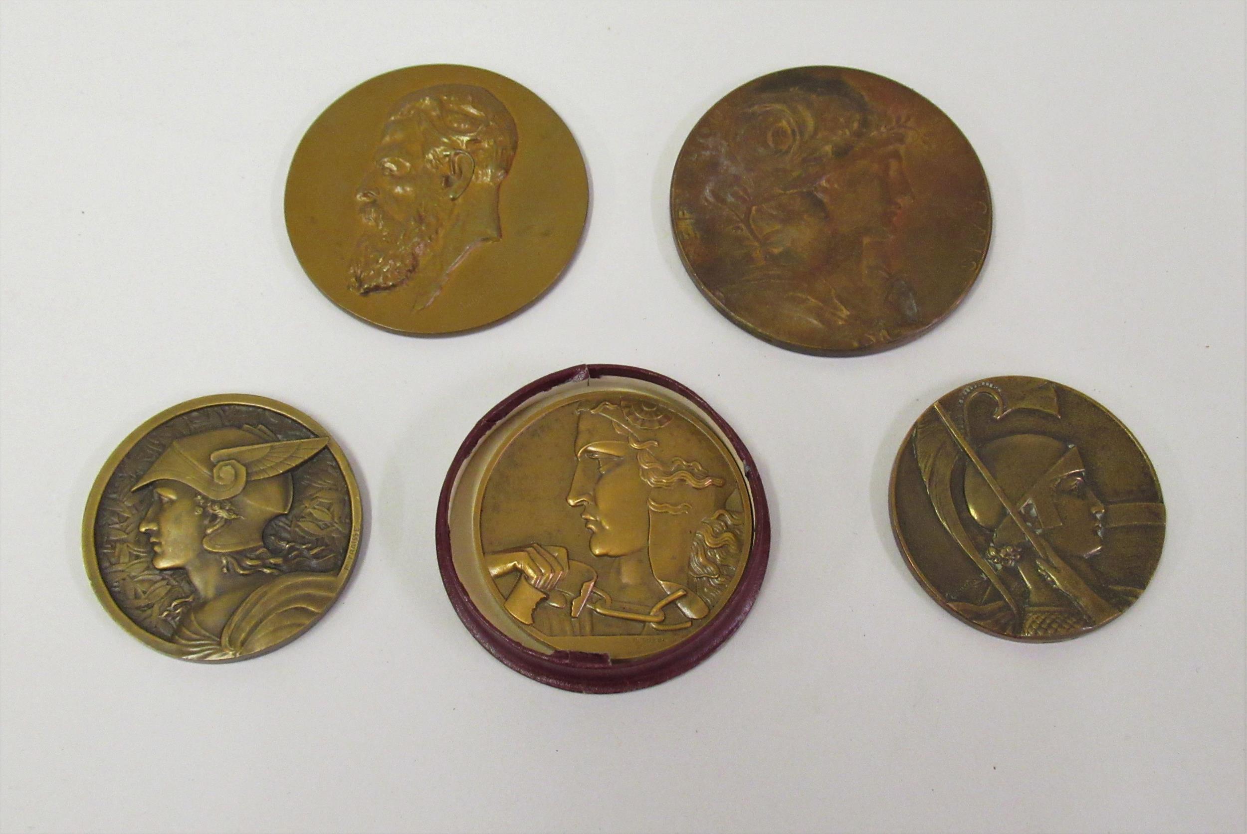 Group of five various French circular bronze medallions, including Exposition Universal Paris 1889