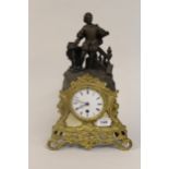 19th Century French gilded and dark patinated spelter single train mantel clock with figural